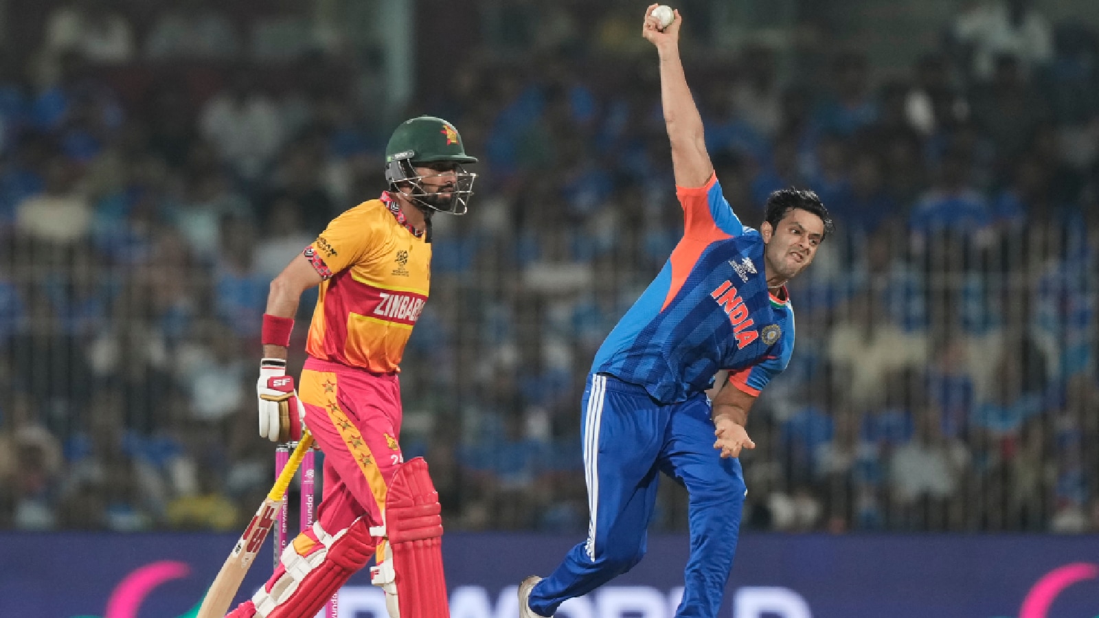 India's Shivam Dube, right, bowls a delivery during the T20 World Cup cricket match between India and Zimbabwe in Chennai, India, Thursday, Feb. 26, 2026. (AP Photo)