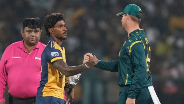 Sri Lanka's Pathum Nissanka shake hands with Australia's Steve Smith after the T20 World Cup Group B match. (PHOTO: AP)