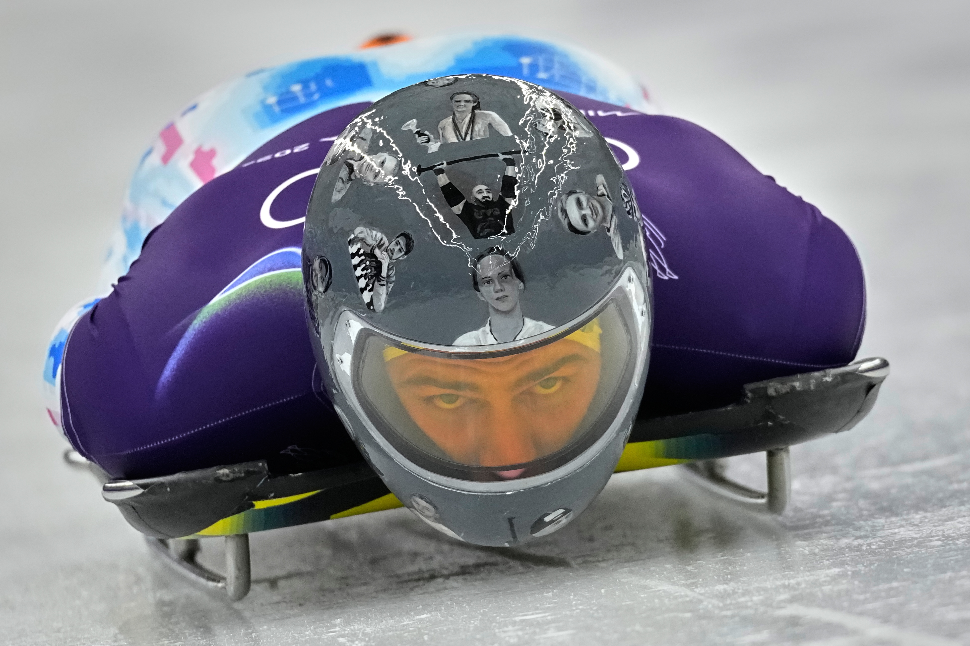 Ukraine's Vladyslav Heraskevych starts a men's skeleton training session at the 2026 Winter Olympics, in Cortina d'Ampezzo, Italy, Monday, Feb. 9, 2026. (AP PhotoAlessandra Tarantino)