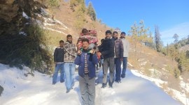 Road under 3-ft snow, villagers in Himachal’s Mandi carry 75-year-old patient for 7km in makeshift chair