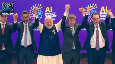 Prime Minister Narendra Modi, centre, joins hands with Google CEO Sundar Pichai, OpenAI CEO Sam Altman and others during the India AI Impact Summit 2026, in New Delhi. Amodei stands next to Altman.