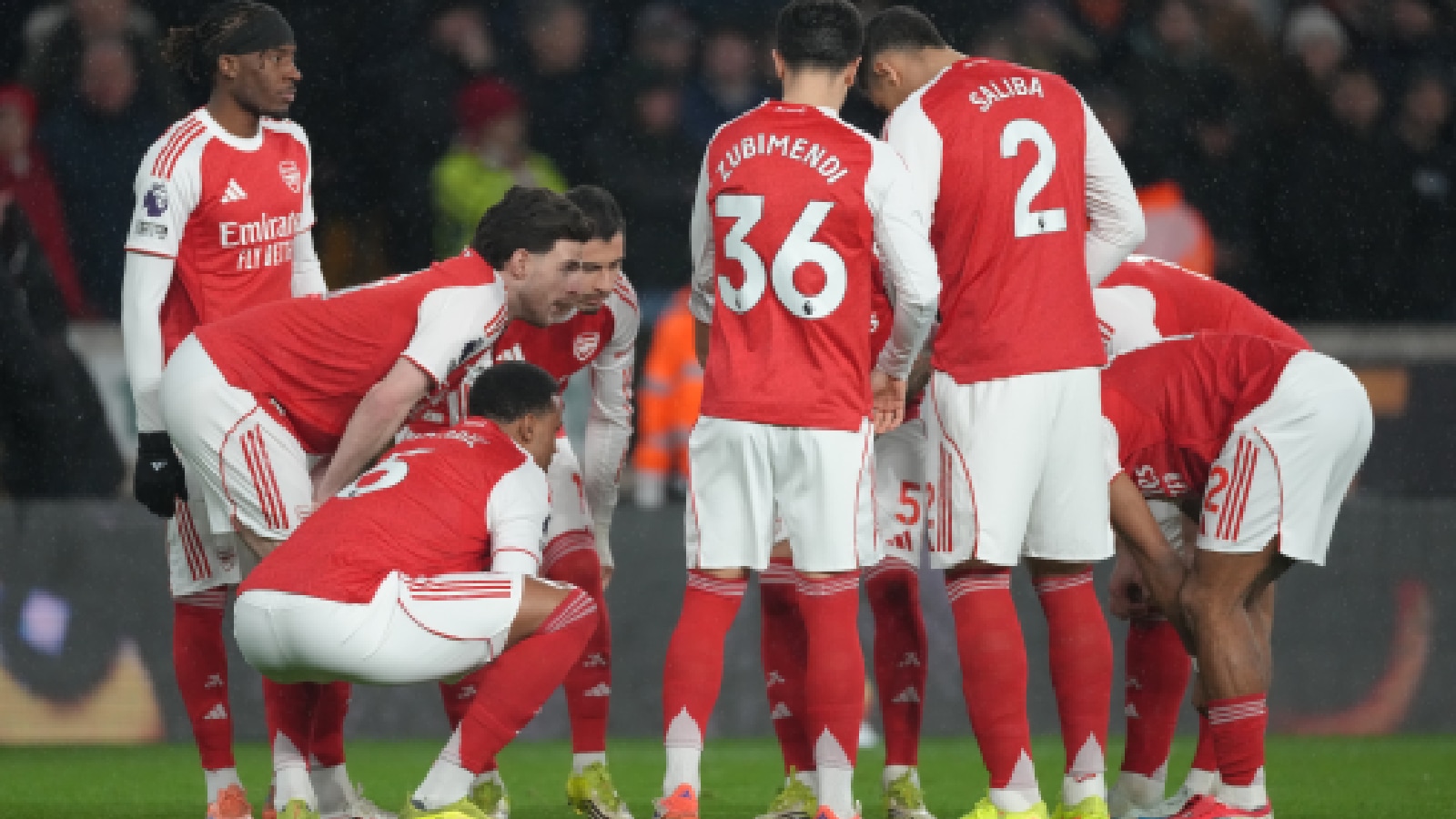 Arsenal team players talk before the Premier League soccer match between Wolverhampton Wanderers and Arsenal in Wolverhampton. (AP Photo)