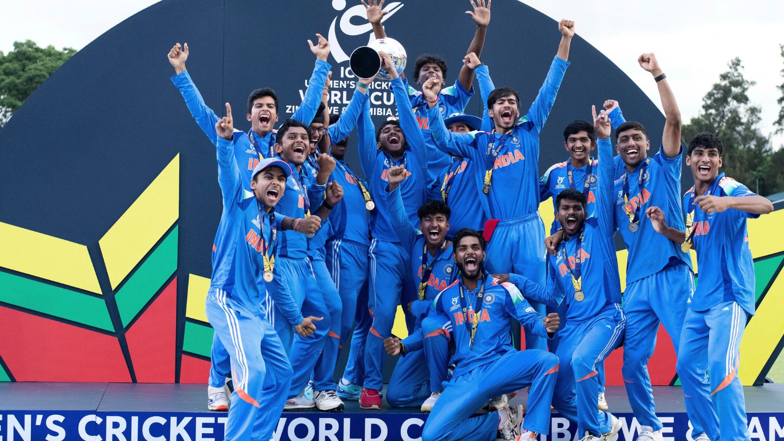 India's players celebrate winning the ICC men's Under-19 World Cup cricket match between England and India, in Harare, Zimbabwe, Friday.