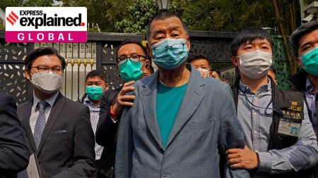 Hong Kong media tycoon Jimmy Lai, center, who founded local newspaper Apple Daily, was arrested by police officers at his home in Hong Kong on April 18, 2020. (AP Photo)