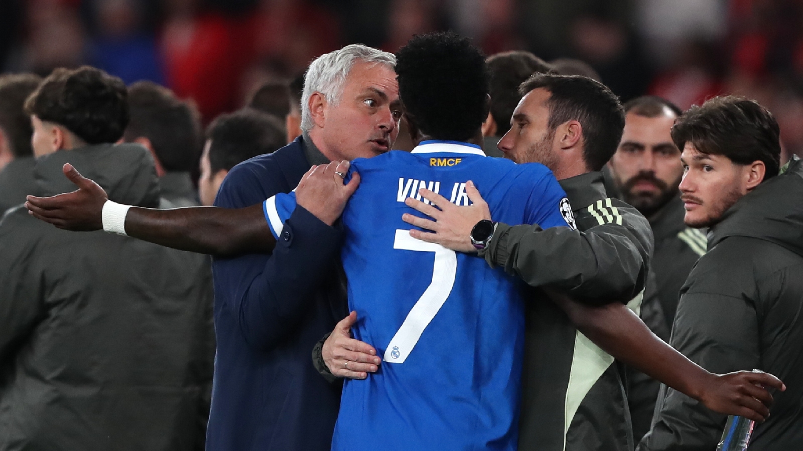 Real Madrid's Vinicius Junior argues with Benfica's head coach José Mourinho after scoring the opening goal during a Champions League playoff soccer match between SL Benfica and Real Madrid in Lisbon. (AP Photo)