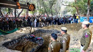 The DJB claimed in an official statement that preliminary investigations showed that the road on which work was underway had been closed with barricades and green mesh, and that the pit too, had been protected with green mesh. (Express photo by Praveen Khanna)