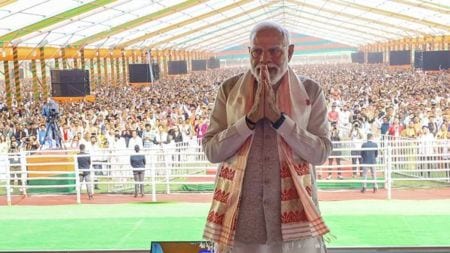 Prime Minister Narendra Modi greets during a massive public rally, in Guwahati on Saturday.