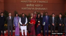 Union Minister for Finance Nirmala Sitharaman poses with her team for a photo op before leaving to present the Budget in New Delhi