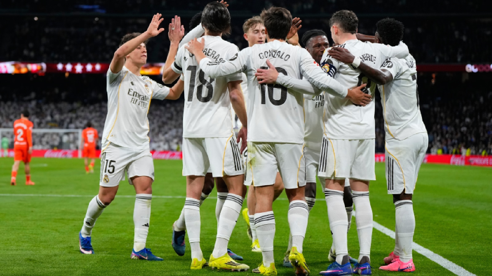 Real Madrid's Federico Valverde is congratulated after scoring his side's 3rd goal during the Spanish La Liga soccer match between Real Madrid and Real Sociedad. (AP Photo)