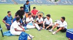 Siddhant Adhatrao (2nd from left) looks on as Suryakumar Yadav holds court after practice at the Reliance ground in Mumbai.