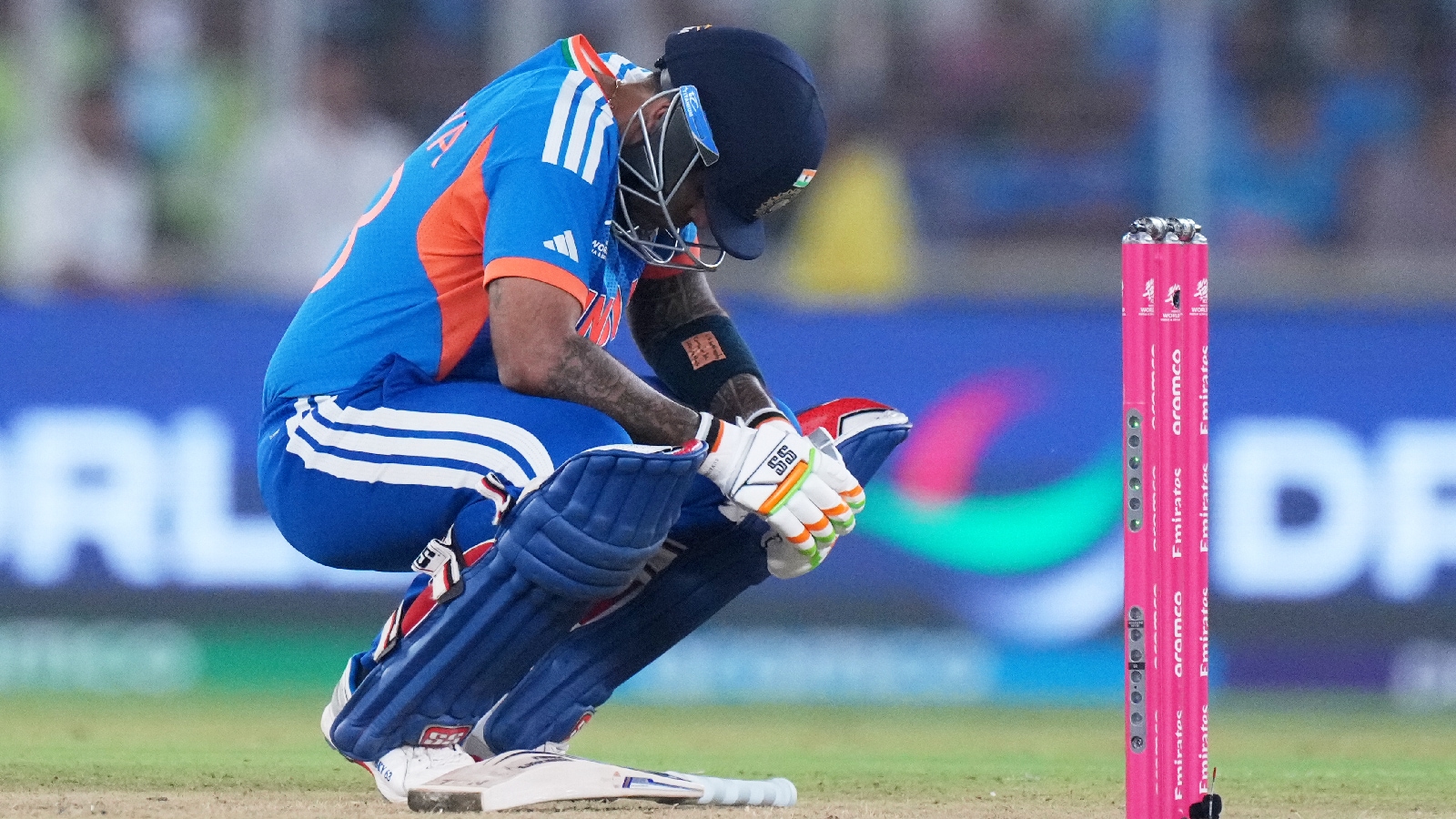 India's captain Suryakumar Yadav takes a breather after getting hit by a delivery from South Africa's Lungi Ngidi during the T20 World Cup cricket match between India and South Africa in Ahmedabad. (AP Photo)