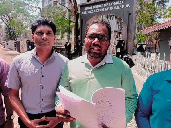 Petitioner Harish Kamble with laywer Ravi Birje (left) at the High Court in Kolhapur. (Express Photo)