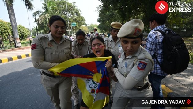 Members of the Tibetan community and supporters gather near the Chinese Embassy in New Delhi to mark the 67th Tibetan National Uprising Day on Tuesday