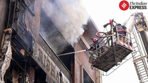 The building, comprising shops on the lower floors and residential units above, quickly filled with smoke