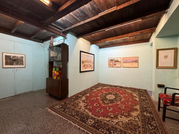 A ground floor room displaying Patna Kalam works from an exhibition by Mahesh Soundatte and Akshay Maksudpur, set within a preserved domestic interior. (Express Photo) 