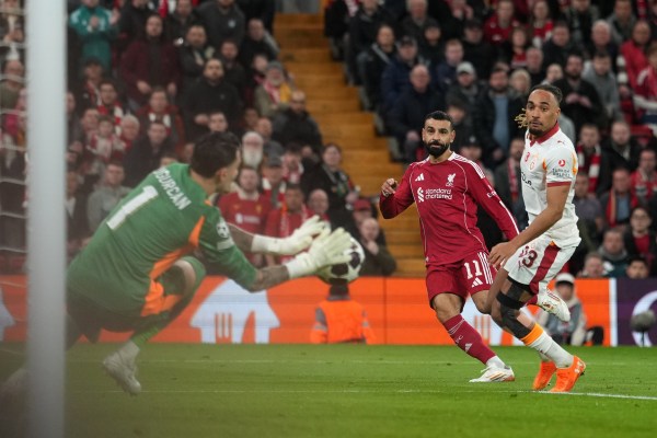 Galatasaray's goalkeeper Ugurcan Cakır makes a save in front of Liverpool's Mohamed Salah during the second leg of the Champions League round of 16 match between Liverpool and Galatasaray. (AP Photo/Jon Super)