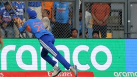 India's Axar Patel catches the ball in the T20 World Cup semi-final against England at Mumbai's Wankhede Stadium. (Express photo Narendra Vaskar)