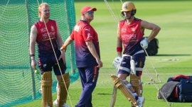 Royal Challengers Bengaluru’s coach Andy Flower, centre, and Jacob Bethell, right, and Jordan Cox during a practice session ahead of the Indian Premier League (IPL) 2026 cricket match against Sunrisers Hyderabad, at M. Chinnaswamy Stadium in Bengaluru, Thursday, March 26, 2026. (PTI Photo)