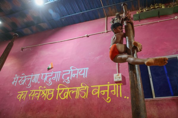 A young athlete performs an aerial rope routine during evening practice at the Abujhmad Mallakhamb and Sports Academy.