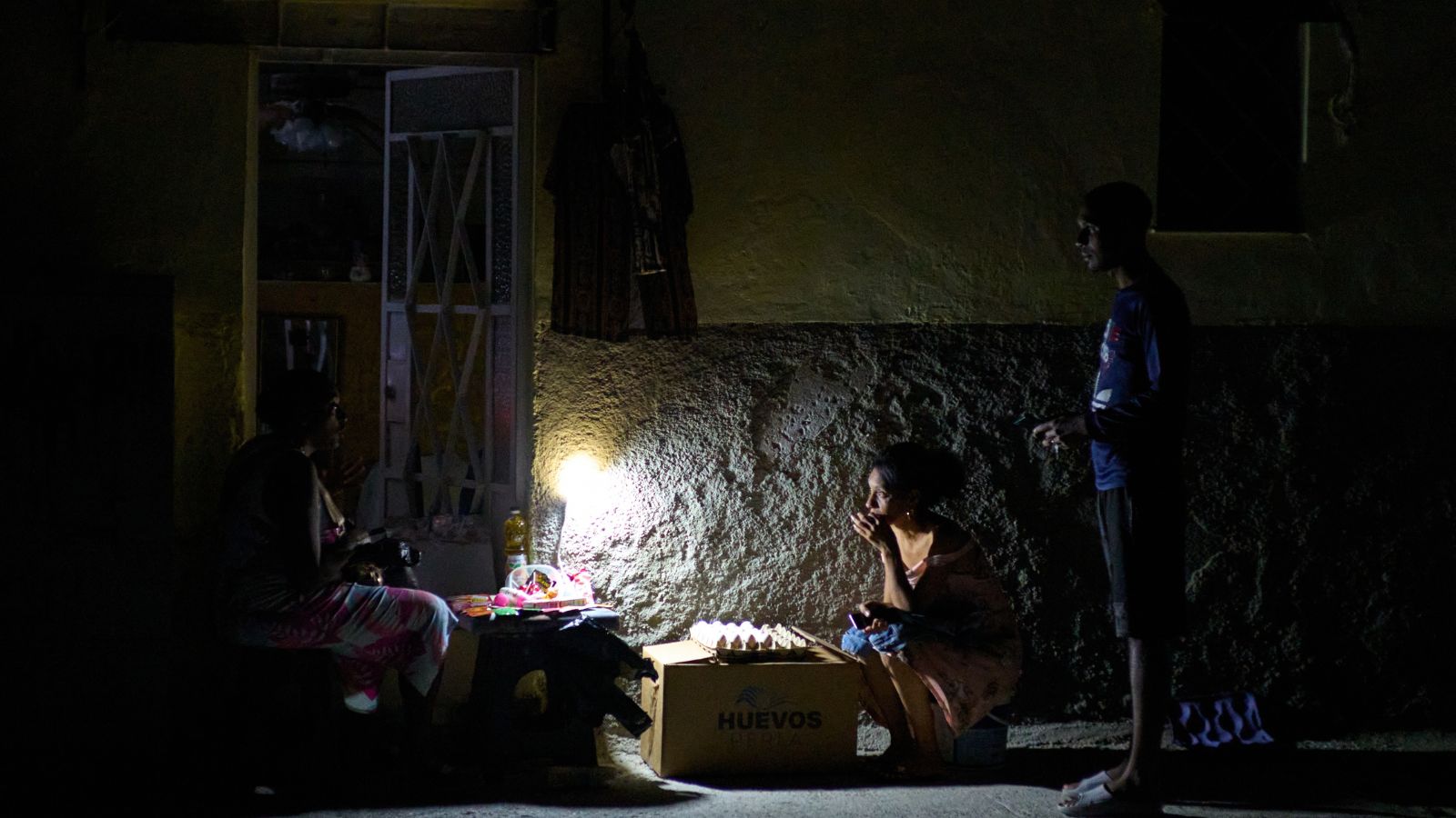 Street vendors during a blackout in Havana on Monday. (AP Photo)