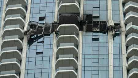 Workers inspect the damage at the Address Creek Harbour hotel after it was hit by a drone strike overnight in Dubai, United Arab Emirates, Thursday, March 12, 2026. (AP Photo) Dubai