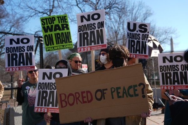 People protest near the White House against U.S. and Israeli strikes on Iran, Saturday, Feb. 28, 2026 in Washington. (AP Photo/Allison Robbert)