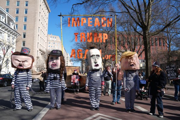 People protest near the White House against U.S. and Israeli strikes on Iran, Saturday, Feb. 28, 2026 in Washington. (AP Photo/Allison Robbert)