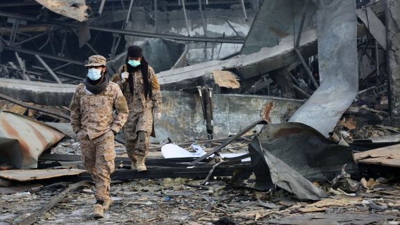 Taliban rescue workers inspect the site of a late-Monday airstrike at a drug rehabilitation hospital in Kabul, Afghanistan (AP Photo)