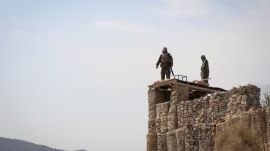 Taliban fighters stand atop a guard post near the Pakistan-Afghanistan border in Khost province, Afghanistan, on February 27, 2026. (Reuters)