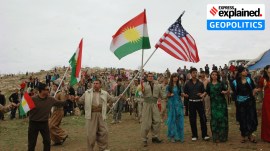 Local citizens wave Kurdish and American flags during the Kurdish regional government new year's celebration in Dahuk, northern Iraq.