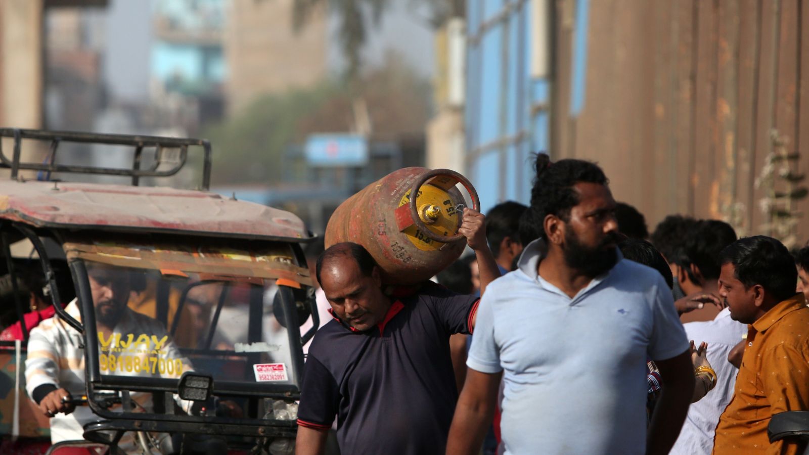 Amid concerns over LPG supply disruptions, long queues were seen outside several gas agencies in Noida as people waited to collect cooking gas cylinders. (Express Photo by Gajendra Yadav)