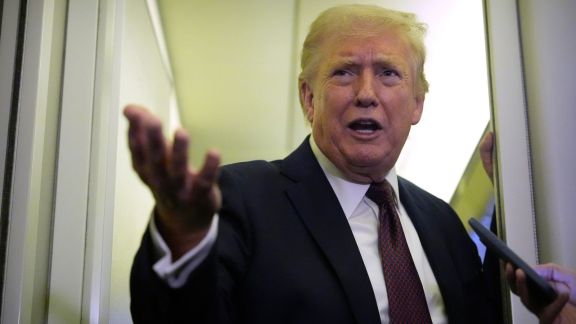 US President Donald Trump speaks to reporters aboard Air Force One, Sunday, March 15, 2026, en route from West Palm Beach, Fla. to Joint Base Andrews