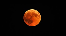 A total lunar eclipse, also known as Chandra Grahan, captured during peak totality.