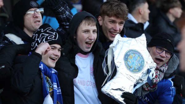 Macclesfield FC fan holds a tin foil replica FA Cup before the match against Crystal Palace. (PHOTO: Reuters)