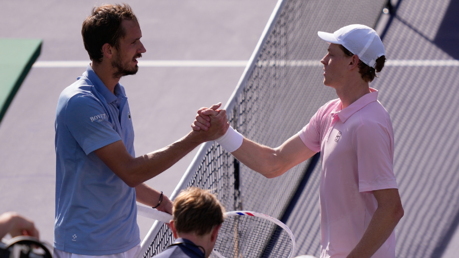 Jannik Sinner, of Italy, right, is congratulated by Daniil Medvedev, of Russia, after Sinner defeated Medvedev during a final match at the BNP Paribas Open tennis tournament, Sunday, March 15, 2026, in Indian Wells, Calif. (AP Photo/Mark J. Terrill)