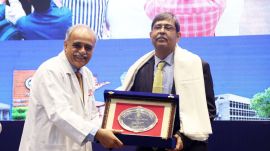 Prof Vivek Lal, Director PGIMER felicitating the Chief Guest Prof Nikhil Tandon at 12th Annual Research Day