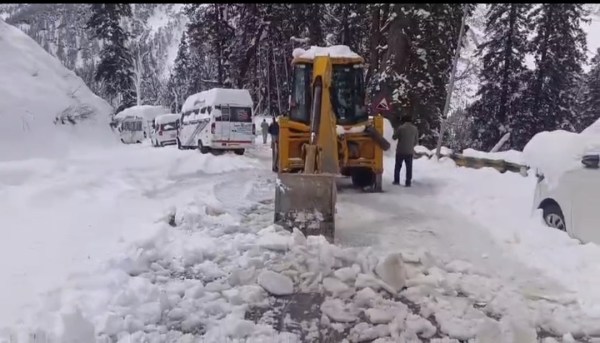 Heavy machinery was deployed to clear the snow-laden roads