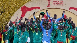 Senegal's Sadio Mane lifts the trophy with teammates as they celebrate after winning the Africa Cup of Nations. (PHOTO: Reuters)