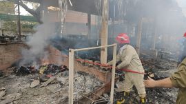 Five to seven fire tenders rushed to the spot, as locals and exhibition staff tried to douse the flames. (Express Photo)