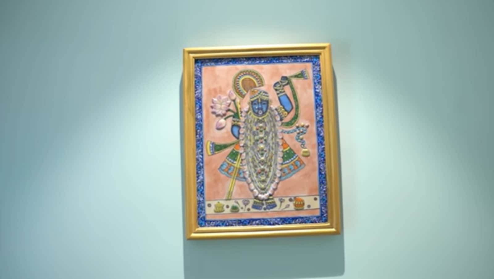 One striking piece features a blue pottery image of Srinathji, blending devotional art with Jaipur&rsquo;s famed ceramic tradition