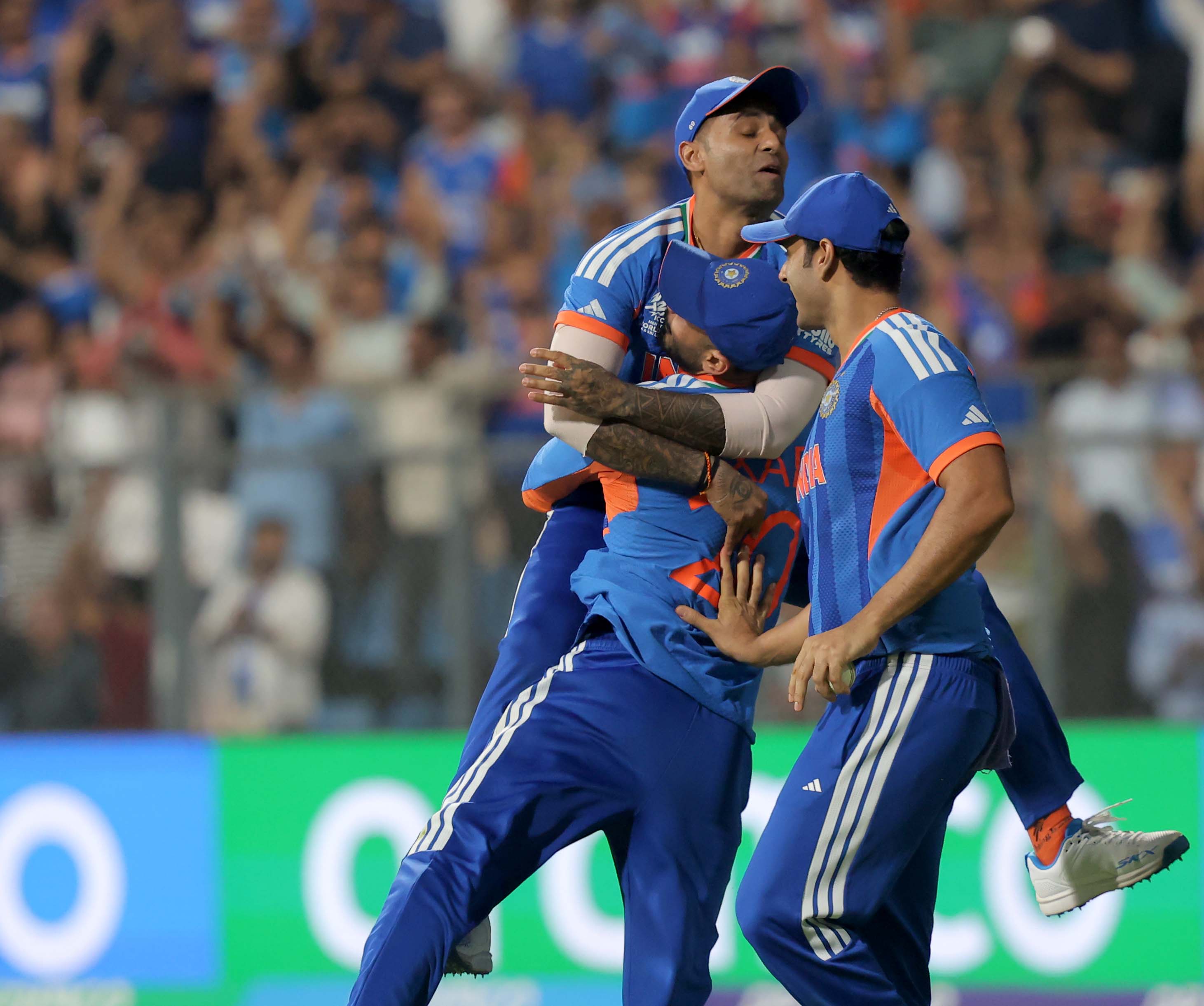 India's Axar Patel, left, and Shivam Dube celebrate the dismissal of England's Will Jacks with India captain Suryakumar Yadav during the T20 World Cup cricket semi-final match between India and England.(Express photo by Narendra Vaskar)