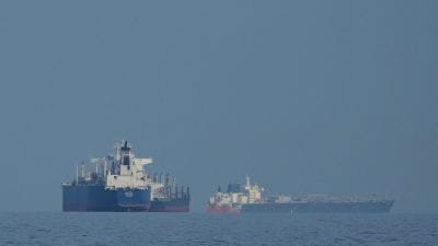 Oil tankers and cargo ships line up in the Strait of Hormuz as seen from Mina Al Fajer, United Arab Emirates, Wednesday, March 11, 2026. (AP Photo)