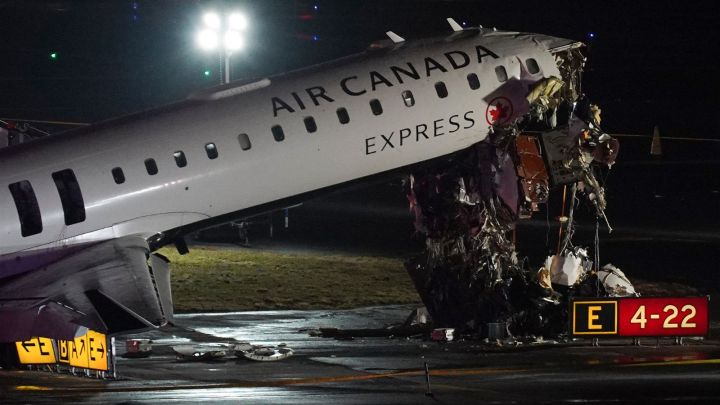 An Air Canada Jet sits on the runway at LaGuardia Airport, Monday, March 23, 2026, after colliding with a Port Authority aircraft rescue and firefighting vehicle after landing in New York. (AP Photo)