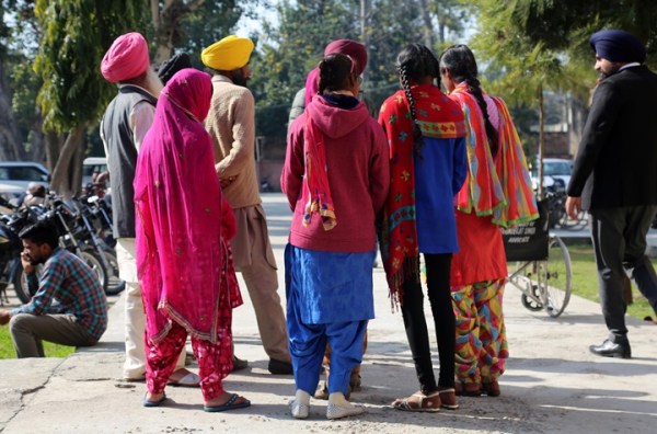 Acid attack victims with their parents at the court complex in Gurdaspur, Punjab, in 2018. The girls were attacked by teenage boys who threw acid on them.