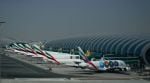 Emirates airplanes are parked at the Dubai International Airport after its closure in Dubai