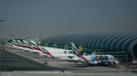 Emirates airplanes are parked at the Dubai International Airport after its closure in Dubai