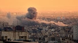 A plume of smoke oil rises following a U.S.-Israeli military strike in Tehran, Iran, Tuesday, March 3, 2026. (AP Photo)
