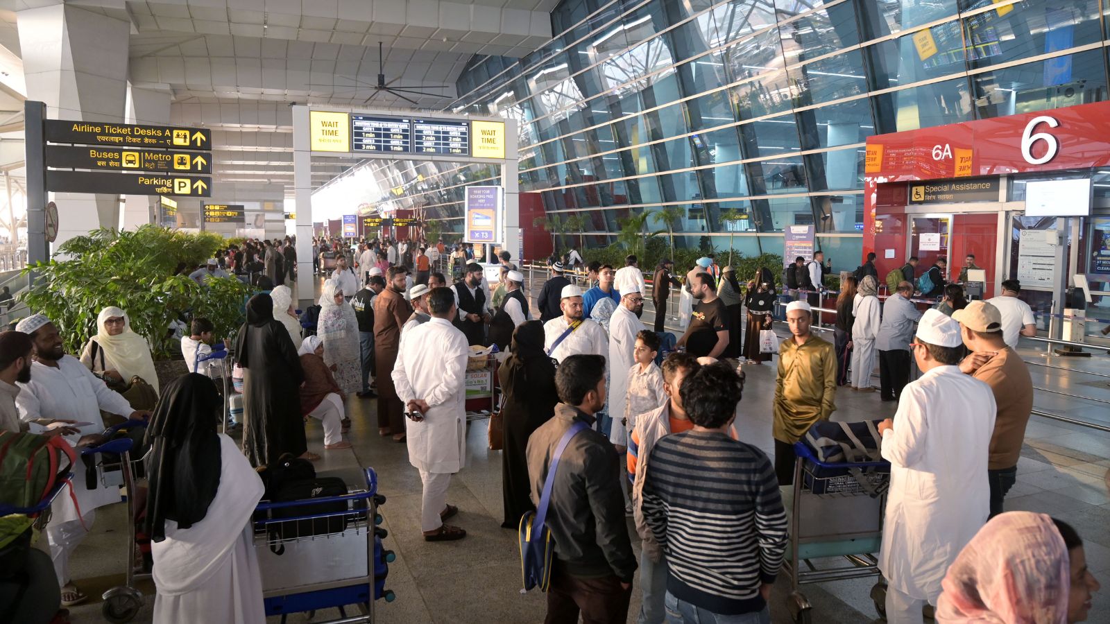  Passengers stranded due to flight disruptions and cancellations following the situation in the Middle East, at Terminal 3 of Indira Gandhi International Airport, in New Delhi on Monday. (ANI Photo)