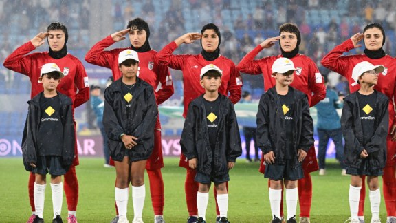 Iran players react during their national anthem ahead of the Women's Asian Cup soccer match between Iran and the Philippines in Robina, Australia, Sunday, March 8, 2026. (Dave Hunt/AAP Image via AP)