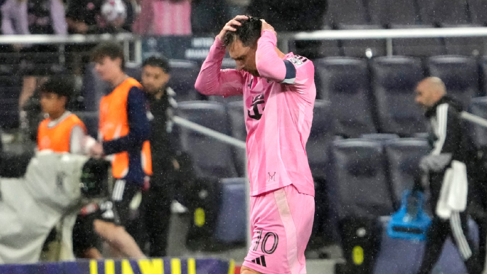 Inter Miami forward Lionel Messi leaves the field in the rain after a draw against Nashville SC in a CONCACAF Champions Cup Round of 16 soccer match, Wednesday, March 11, 2026, in Nashville. (AP Photo)
